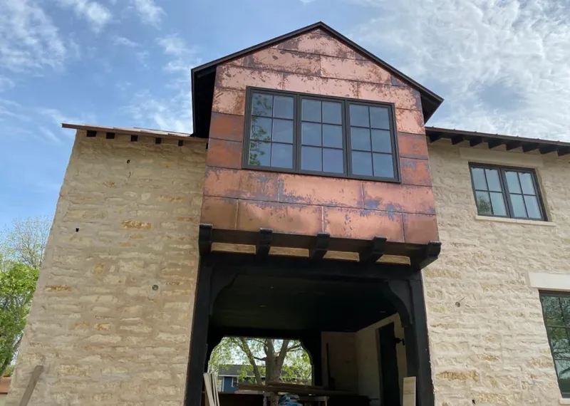 Copper metal panel facade on a stone building for Skylight Installation in Unionville