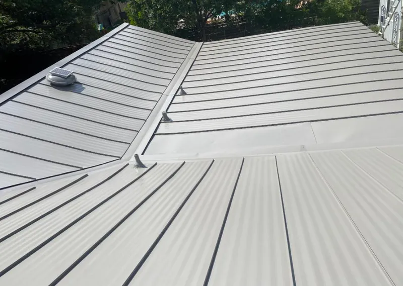 Solar attic fan installed on a metal roof for Roof Ventilation in Unionville